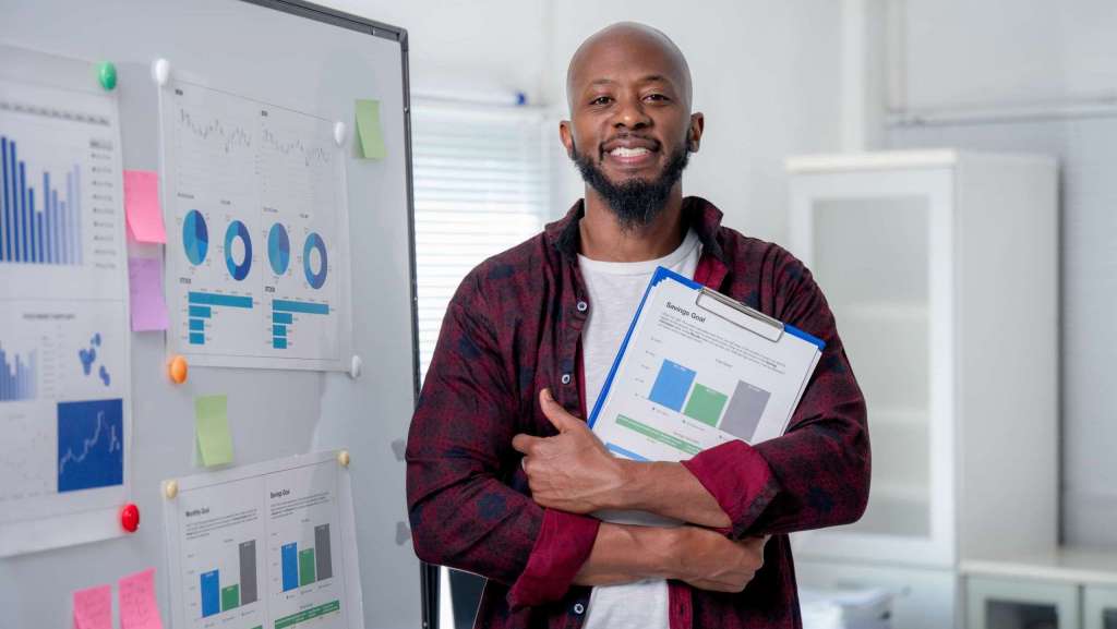 Church leader reviewing communication metrics and reports to evaluate effectiveness.