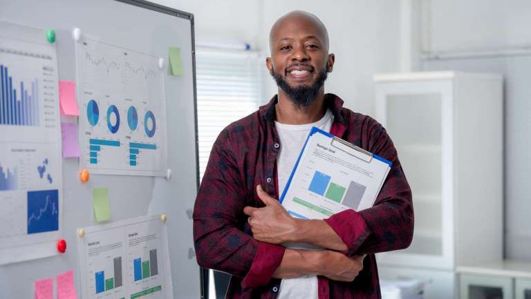 Church leader reviewing communication metrics and reports to evaluate effectiveness.